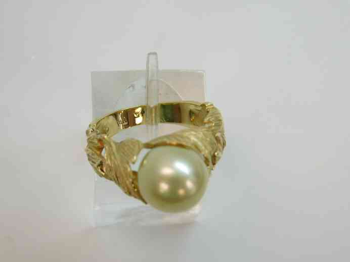 Antique solitaire pearl ring set into 14k gold sculpted leaves band