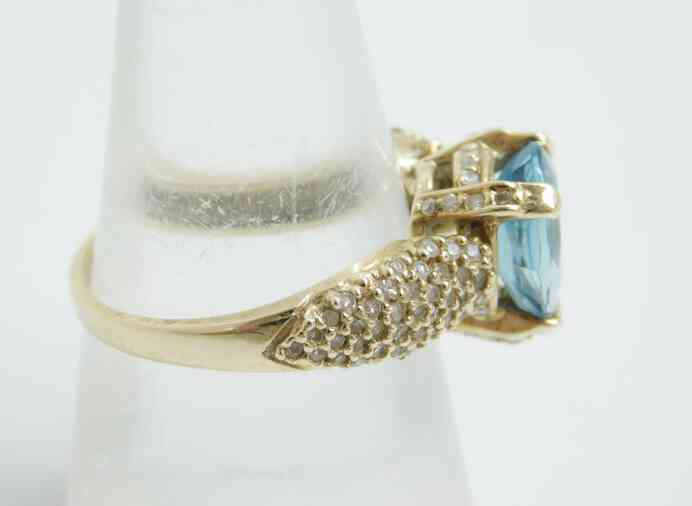 Gold Pear Shape Blue Topaz 0.49 CTTW Round 10K yellow gold size 9.25 ring